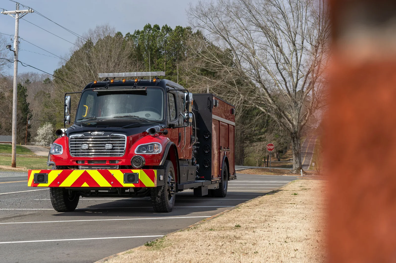Black over red FES pumper on a Freightliner M2 crew cab chassis with chevron front bumper