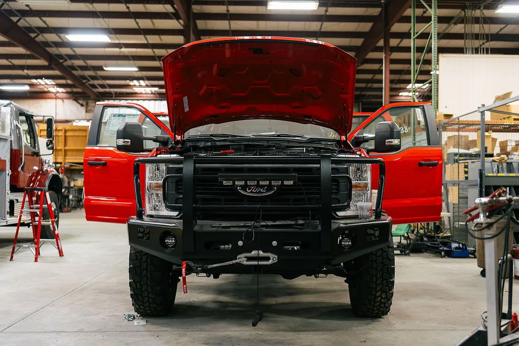 Commercial truck fitted with a fabricated front bumper and winch during an FES upfit